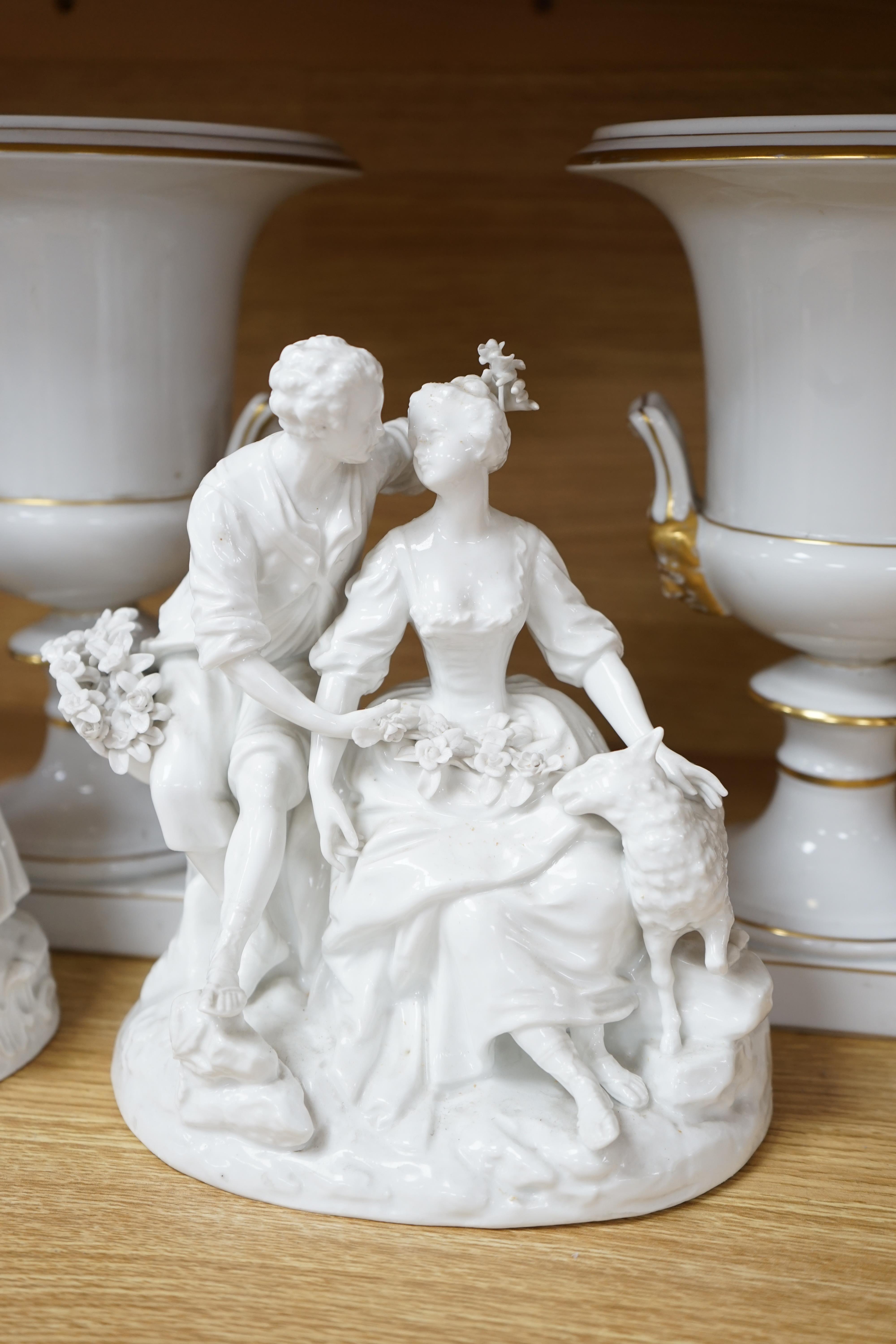 Two Meissen style figure groups, tallest 21cm, and a pair of urns, 26.5cm.